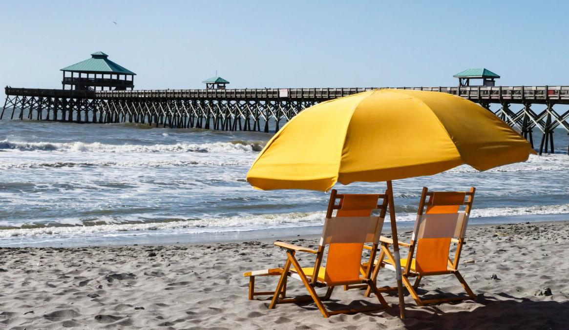 Yellow umbrella and chair at Folly Beach Oceanfront